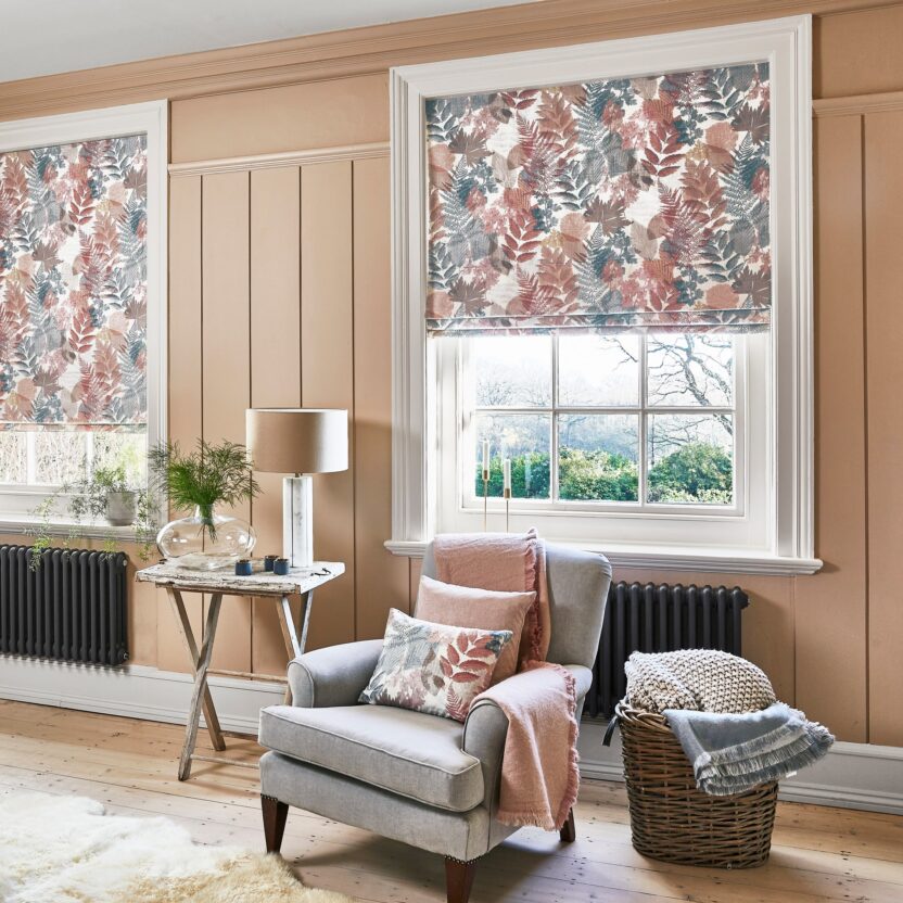 Patterned made-to-measure Roman blinds in a refined sitting room