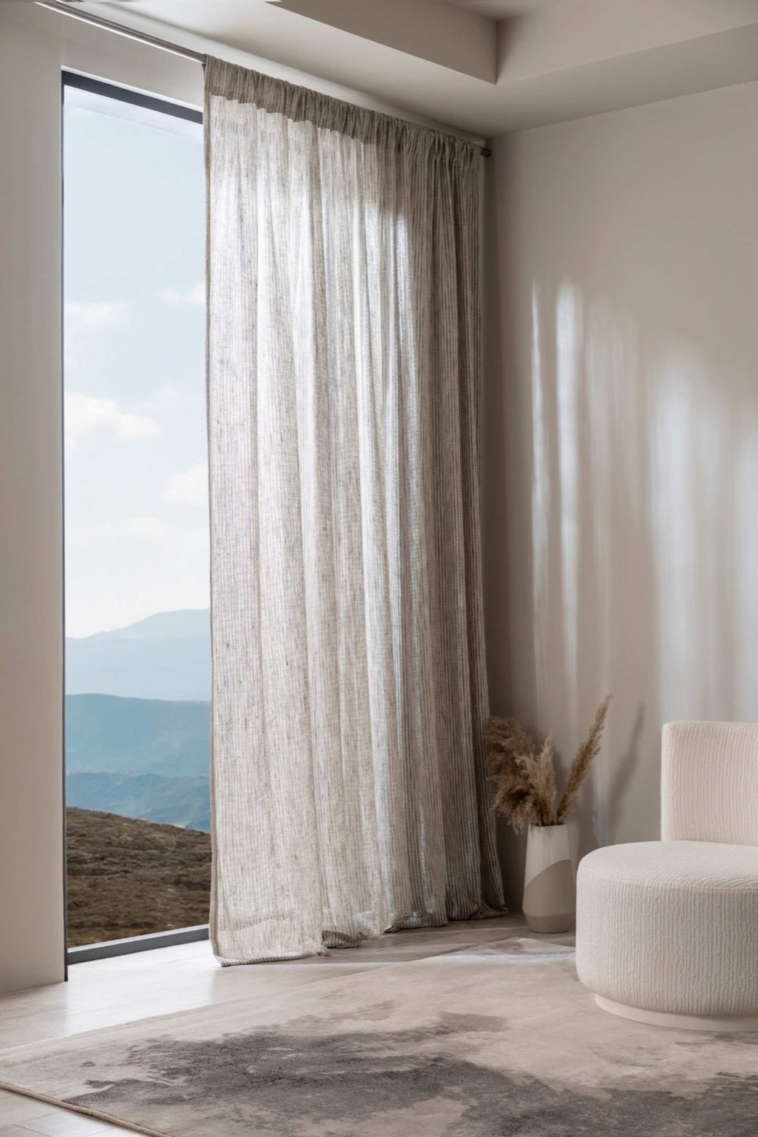 Natural sheer curtains in a calm neutral interior